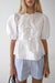 Puff sleeve cotton poplin bow front blouse in white — main image