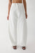 White boucle curve leg pant in ivory — main image